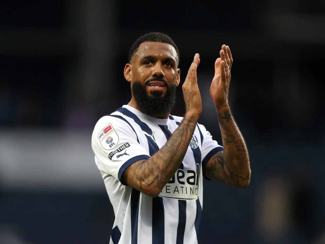 Yann M'Vila applauds Albion fans after beating Bristol City