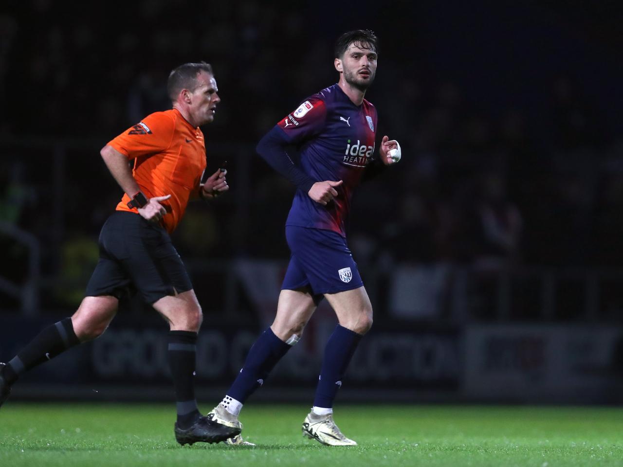 Okay Yokuslu running alongside the referee during the game against QPR 