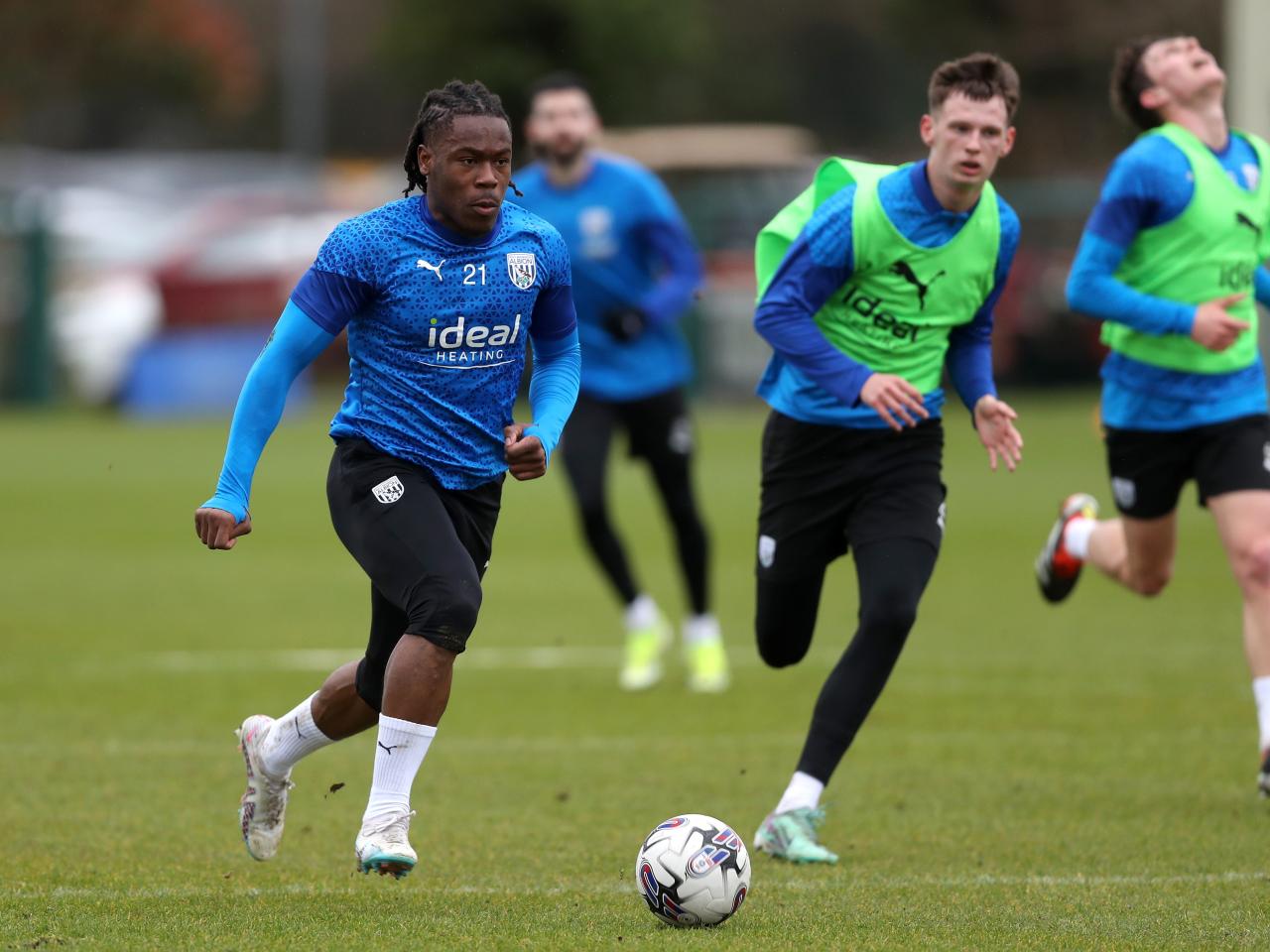 Brandon Thomas-Asante running with the ball during a training session