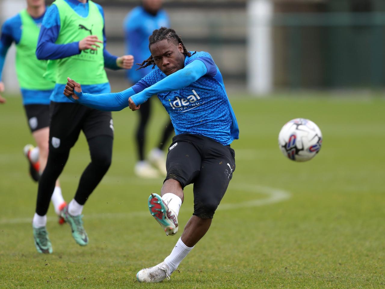 Brandon Thomas-Asante strikes the ball during a training session