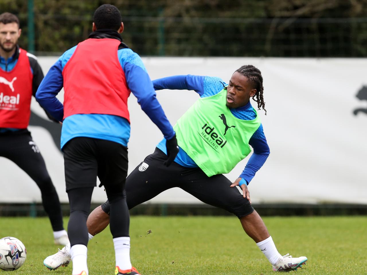 Brandon Thomas-Asante stretches to try and win the ball during a training session