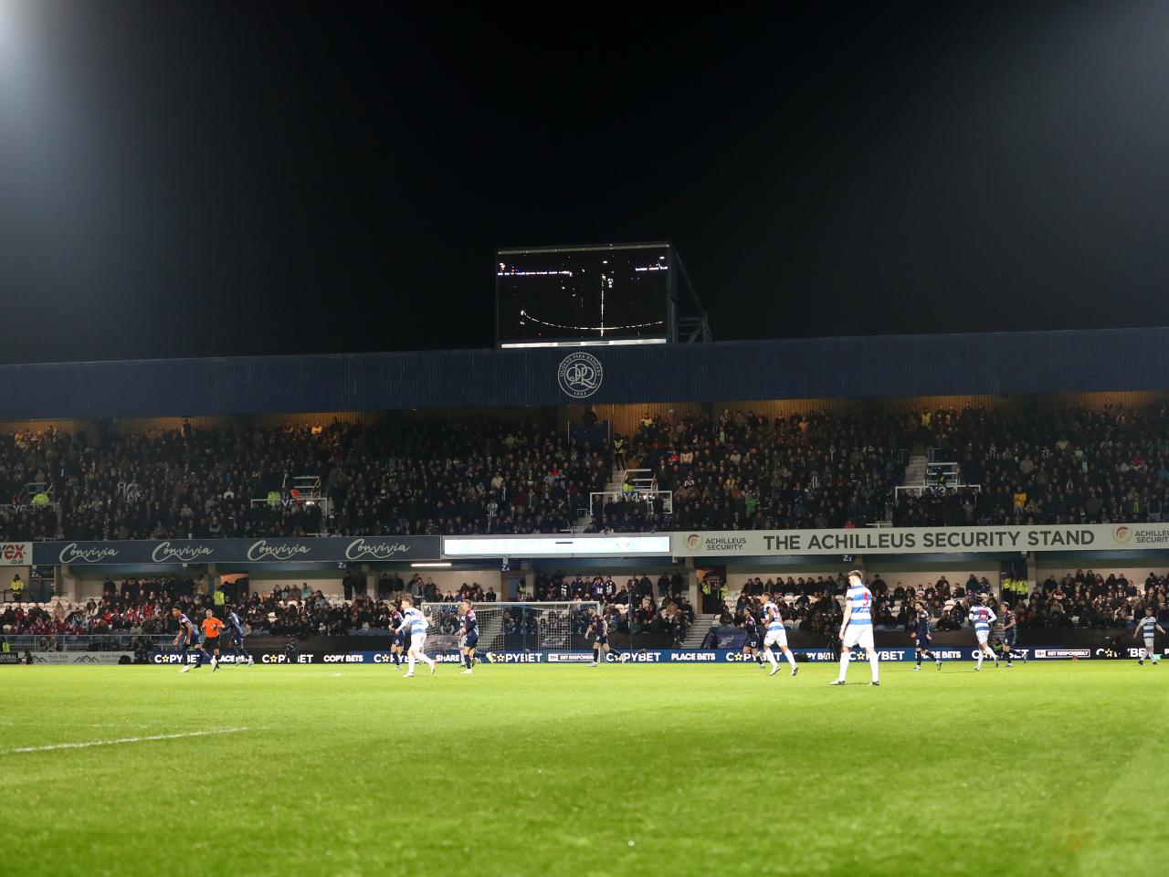 A general view of Albion fans in the top tier of the stand behind the goal at Loftus Road 