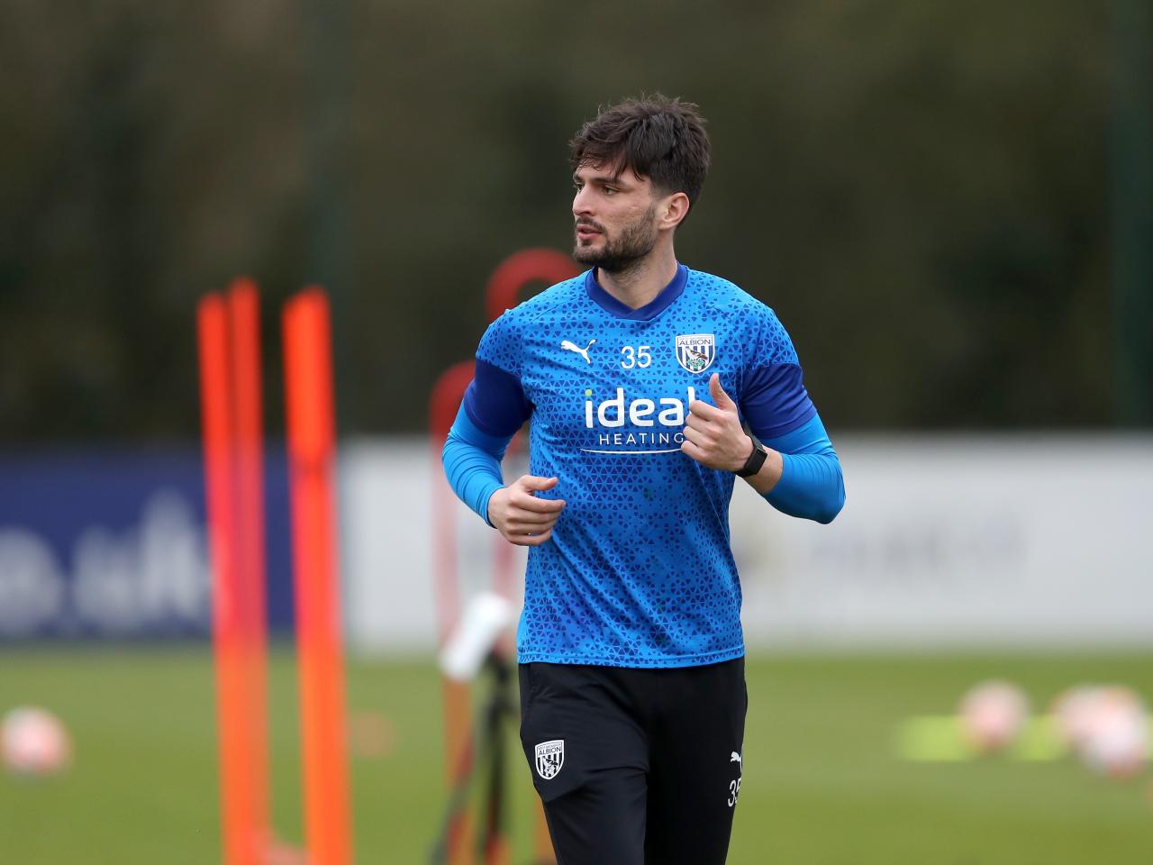 Okay Yokuslu looking to his right during a training session