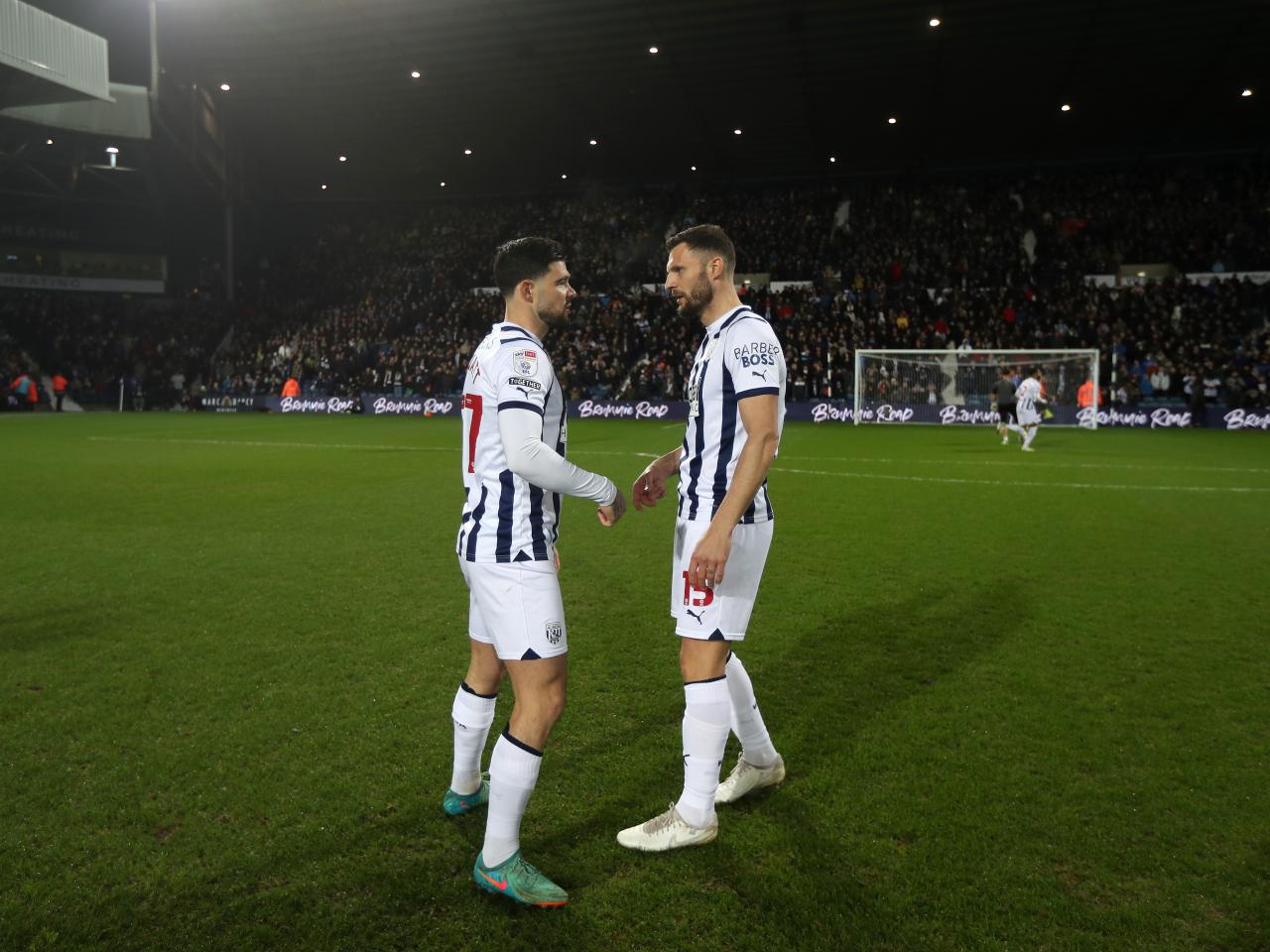 Erik Pieters and Okay Yokuslu facing each other on the pitch before the Coventry game