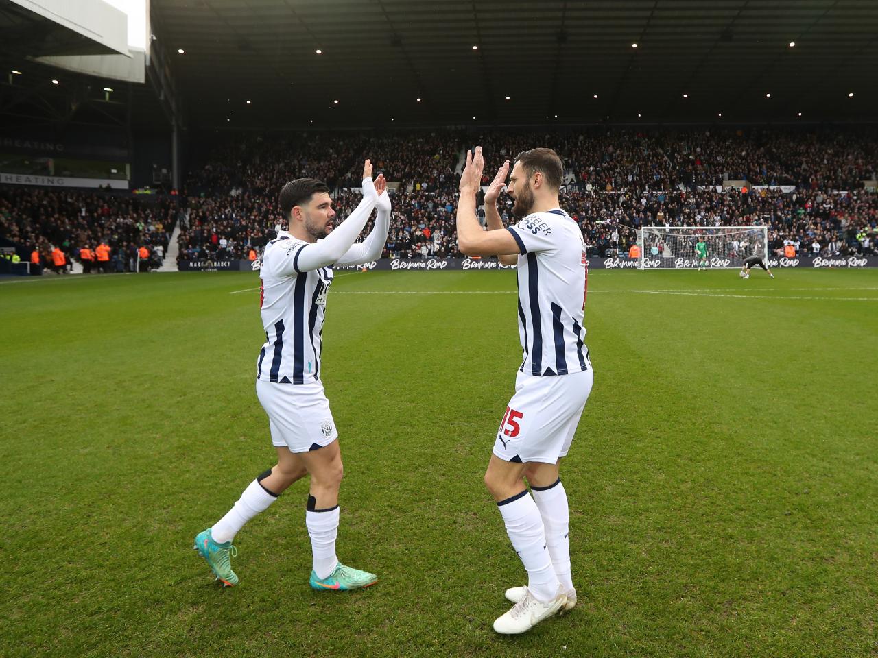 Alex Mowatt and Erik Pieters high-fiving before the game against Bristol City