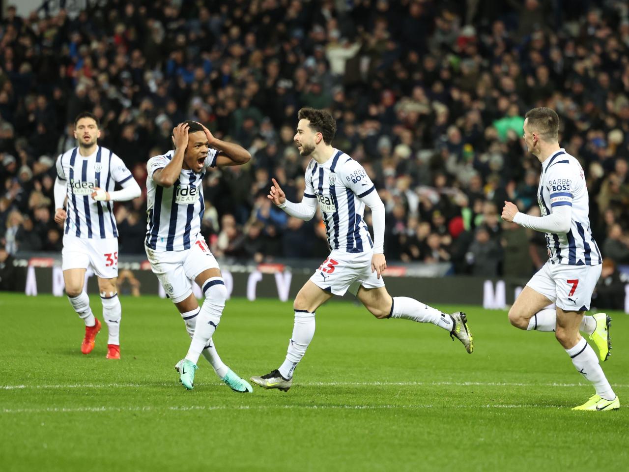 Mikey Johnston celebrates his goal against Coventry while Grady Diangana opens his mouth in amazement 