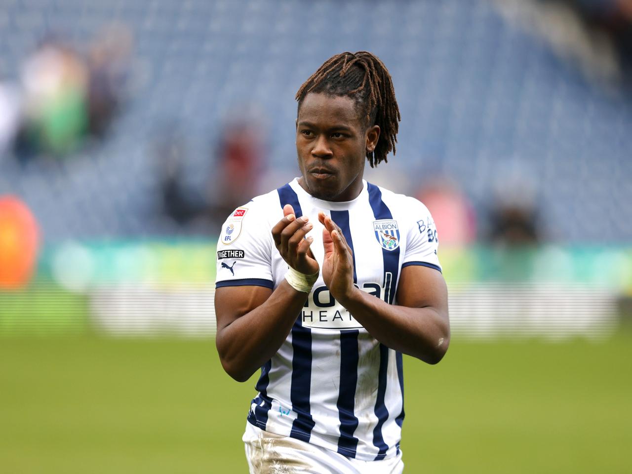 Brandon Thomas-Asante applauding supporters after the Watford game