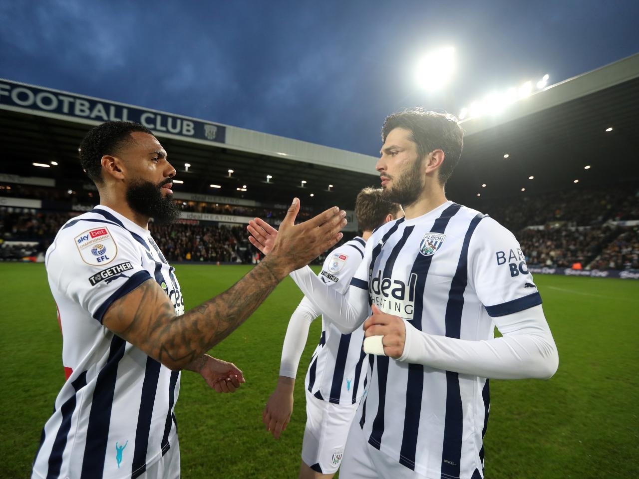 John Swift and Darnell Furlong high five before the game against Rotherham United