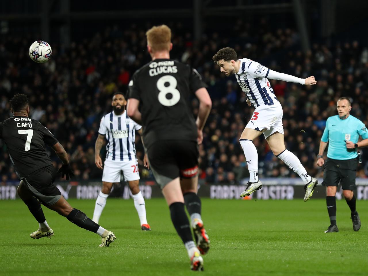 Mikey Johnston heading the ball against Rotherham United