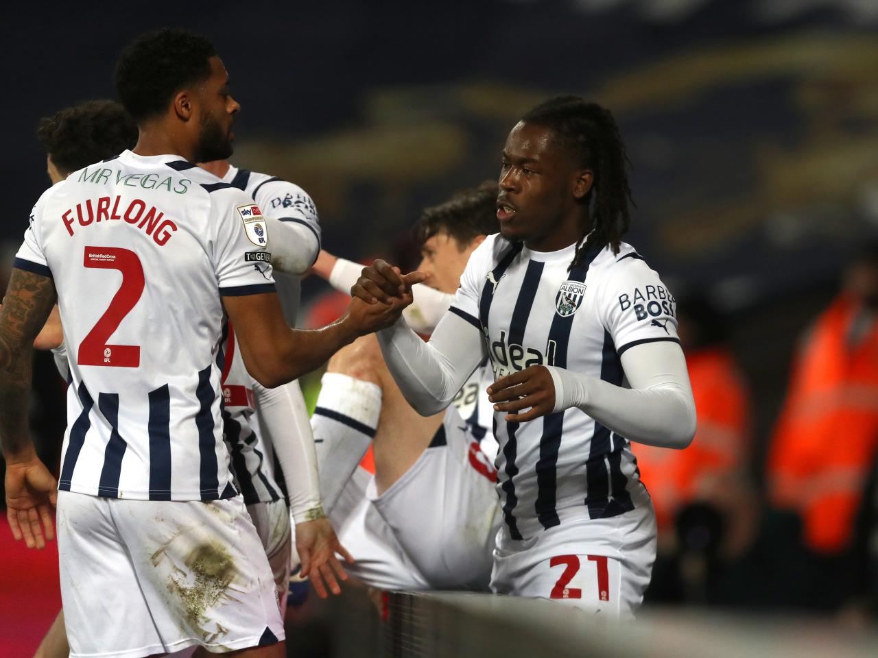 Brandon Thomas-Asante celebrates scoring against Rotherham at The Hawthorns with Darnell Furlong 