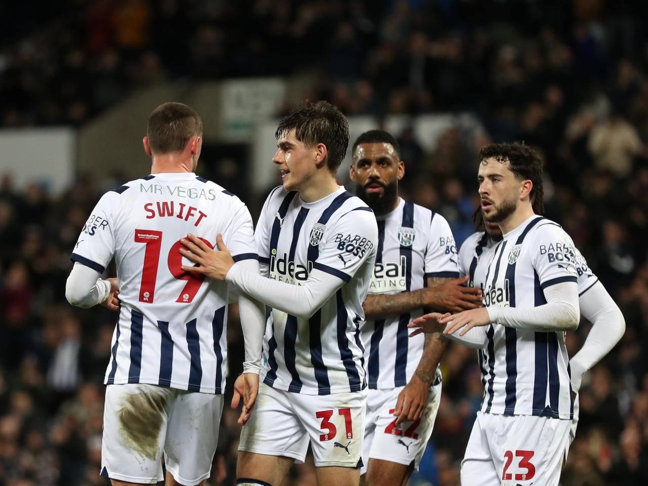 John Swift celebrates scoring against Rotherham United with several team-mates 