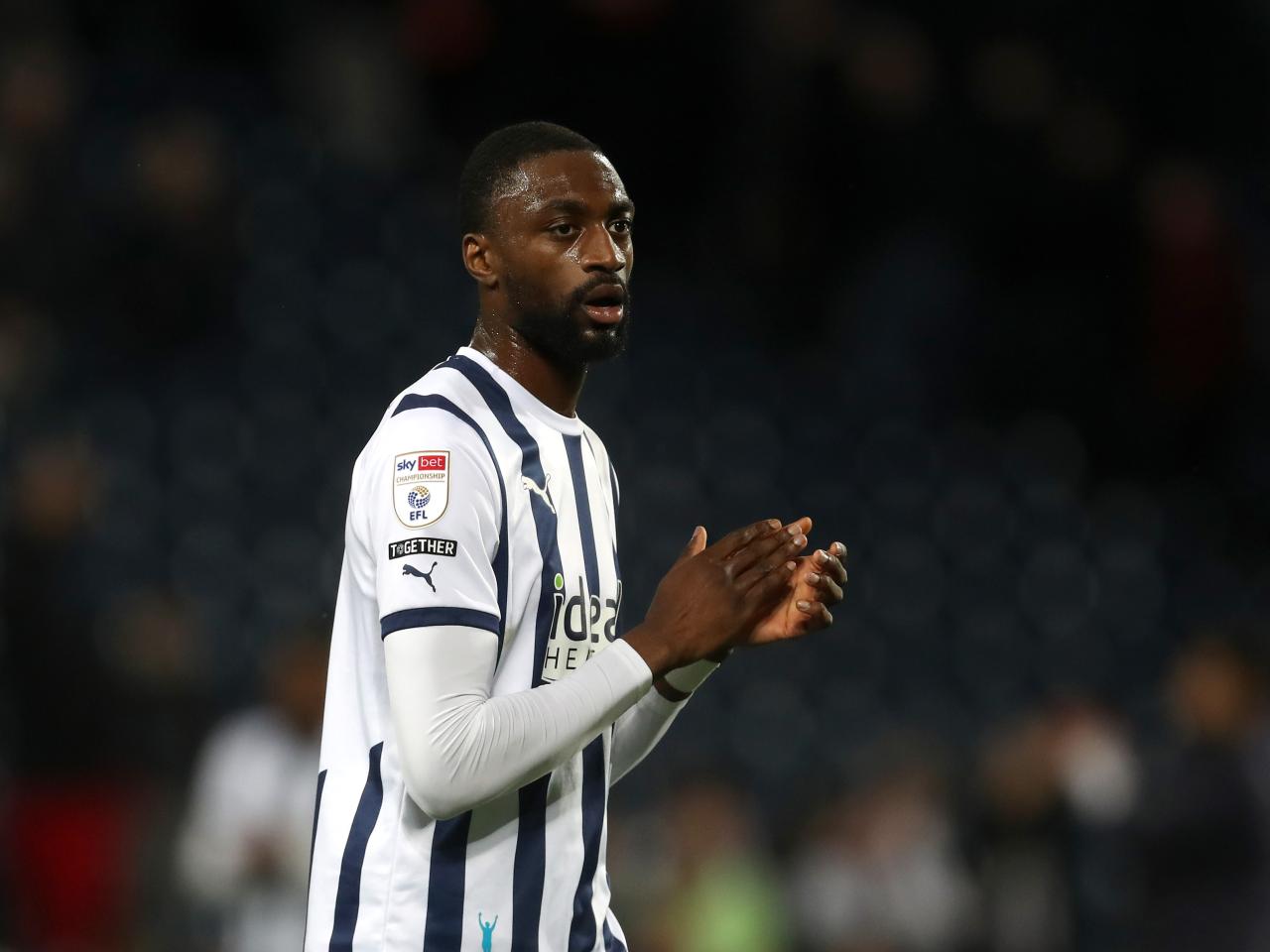 Semi Ajayi applauding Albion fans after the Rotherham game