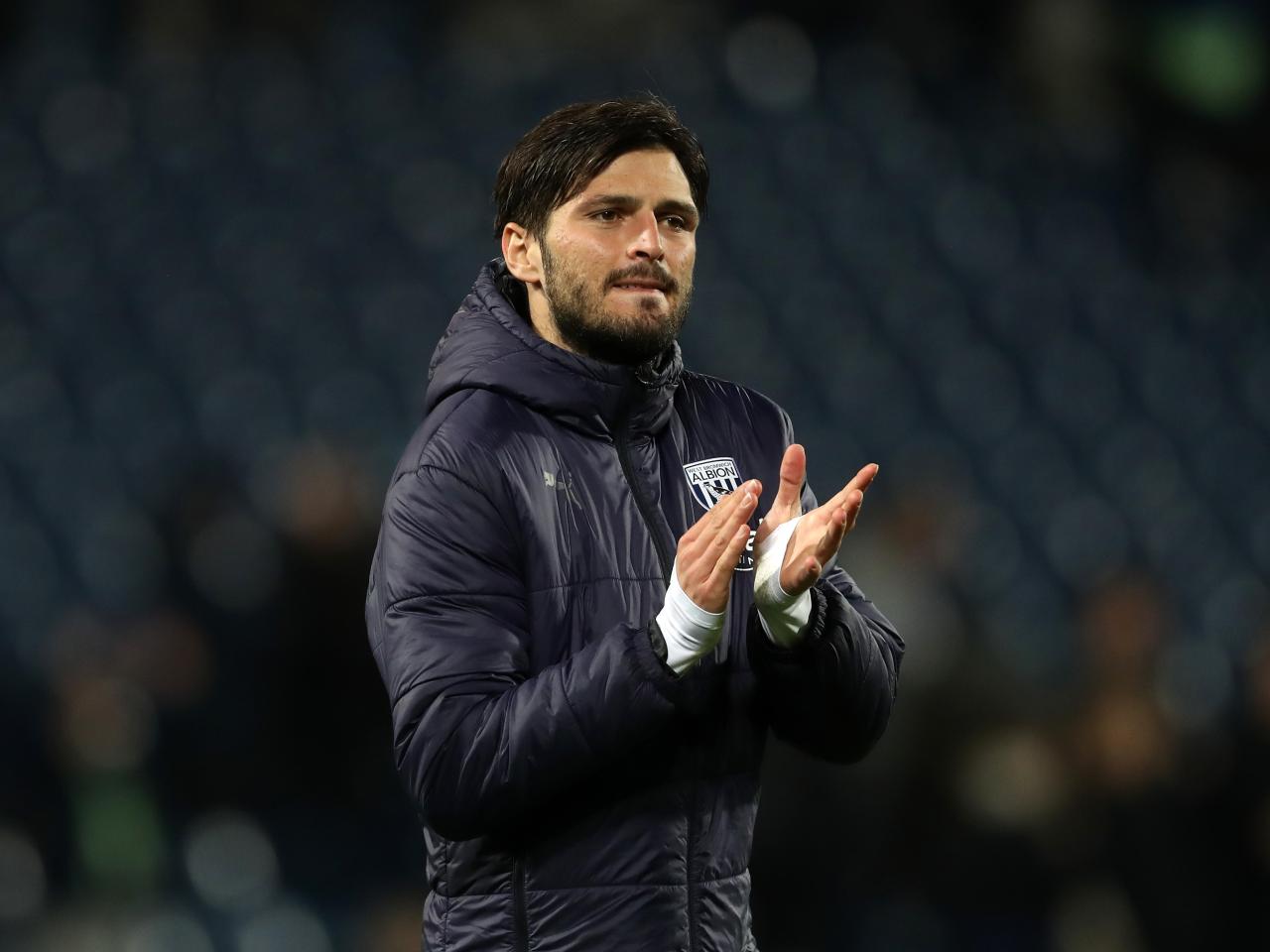 Okay Yokuslu applauding Albion fans after the Rotherham game