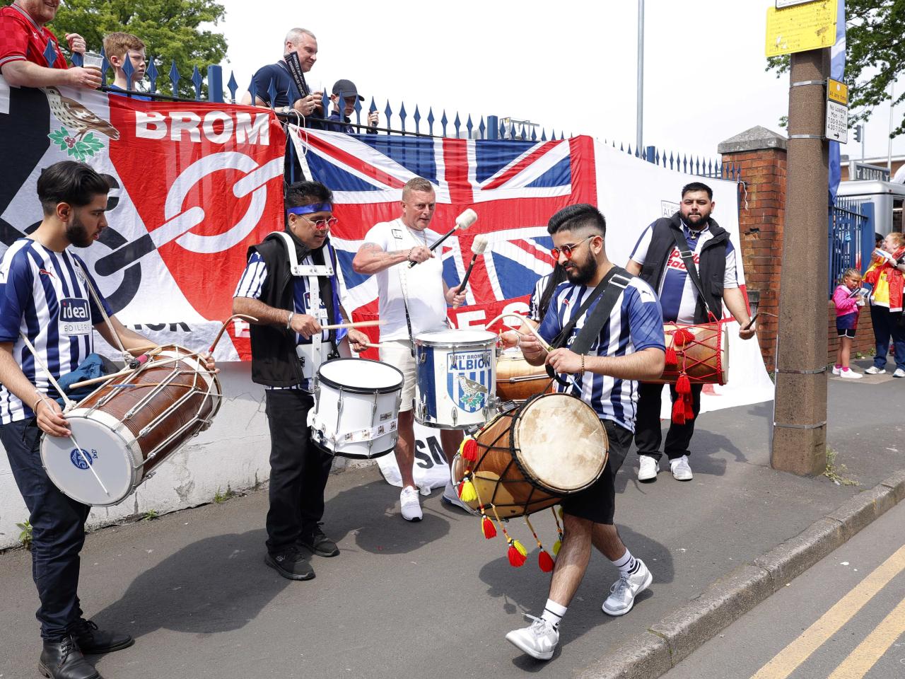 Drummers welcome the Albion team bus to The Hawthorns on Halfords Lane 