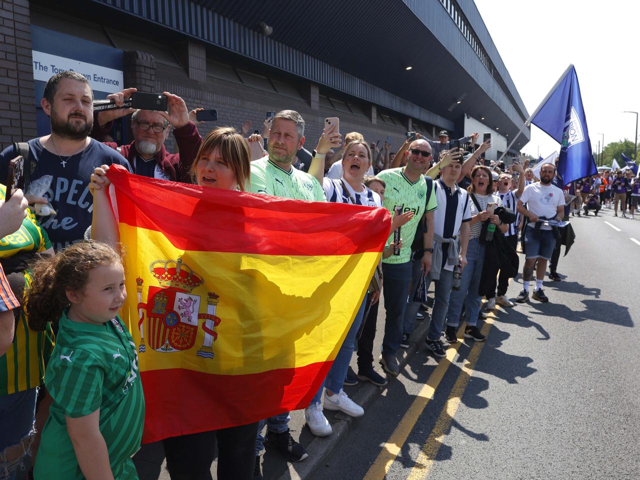 A general view of Albion supporters outside the stadium before the match against Southampton at The Hawthorns with one holding a Spain flag