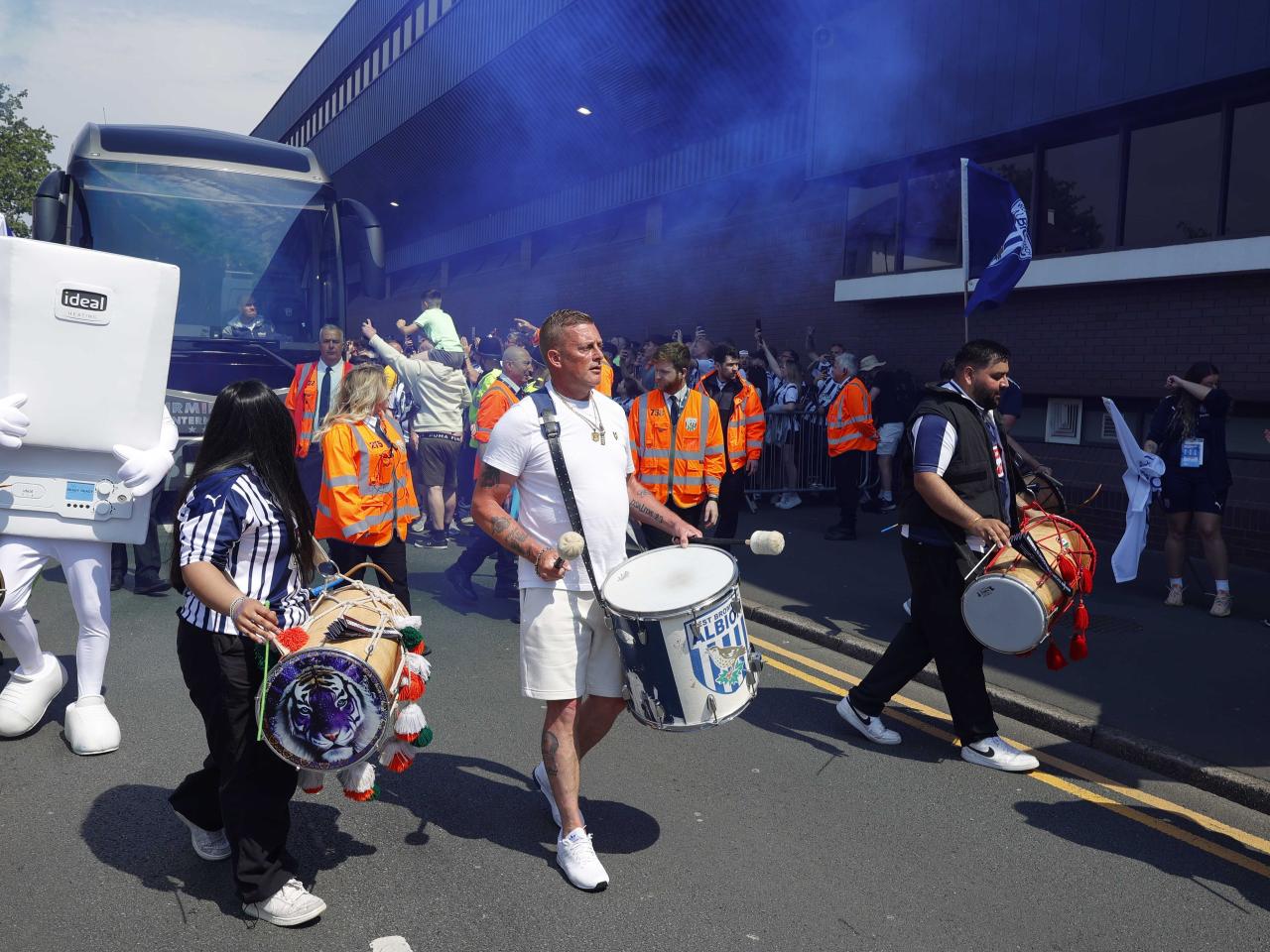 Drummers welcome the Albion team bus to The Hawthorns on Halfords Lane 