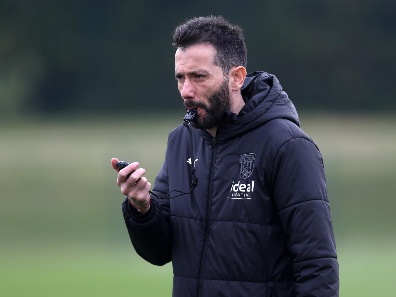 Carlos Corberán blowing his whistle during a training session