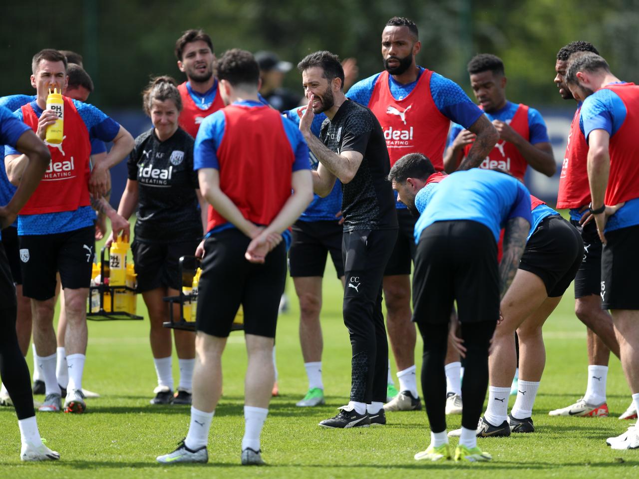 Carlos Corberán delivering messages to his players on the training pitch