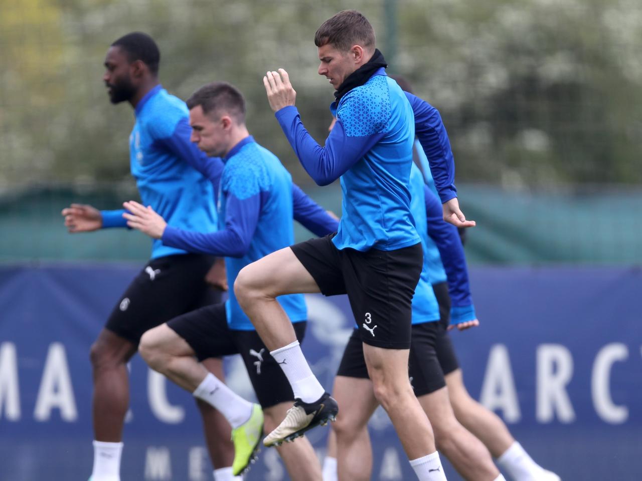 A number of Albion players warm up before a training session