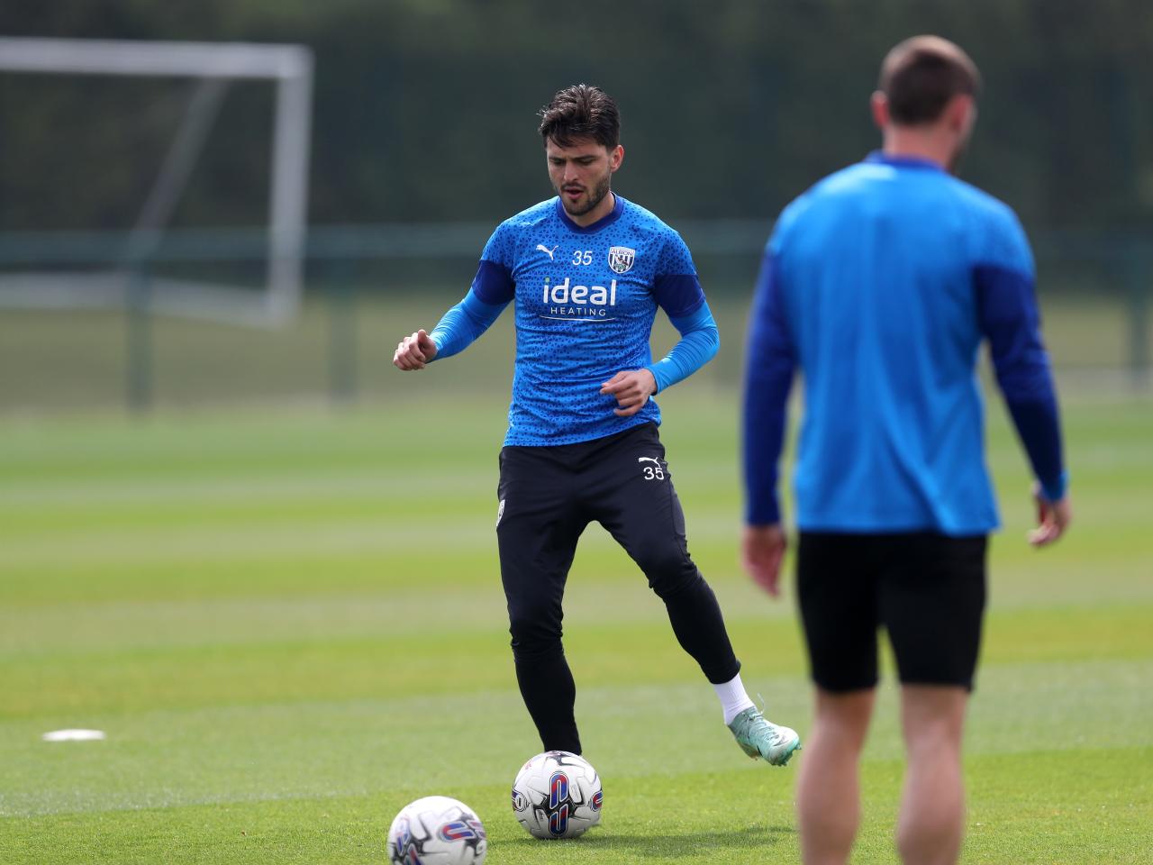 Okay Yokuslu passing a ball during a training session