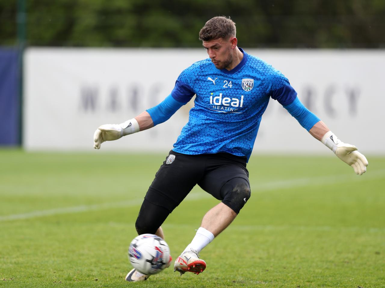 Alex Palmer making a save with his feet in training