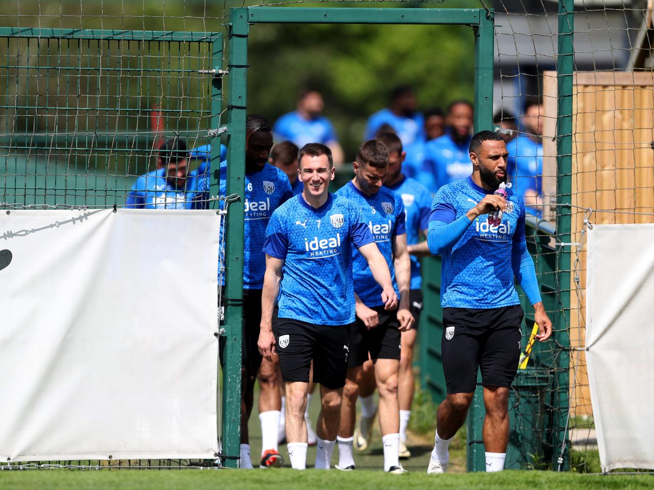 Jed Wallace leads Albion players out onto the training pitch 