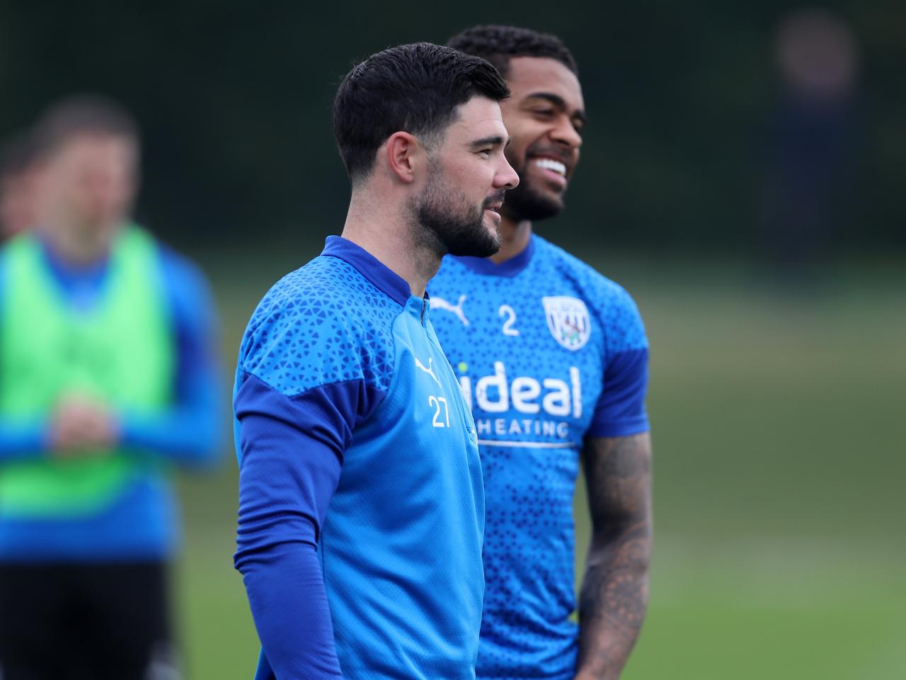 Alex Mowatt and Darnell Furlong smiling during a training session