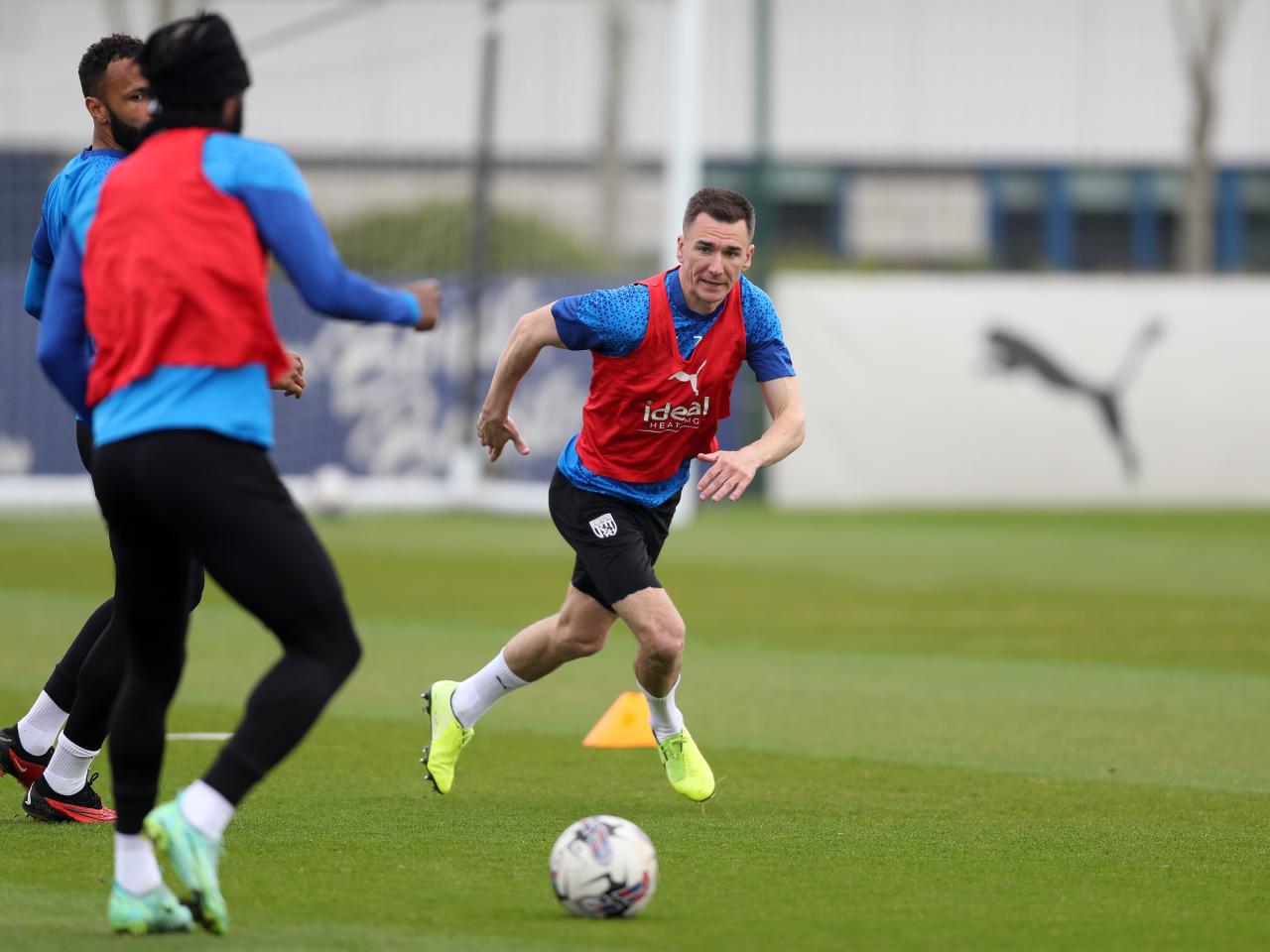 Jed Wallace chasing the ball during training 