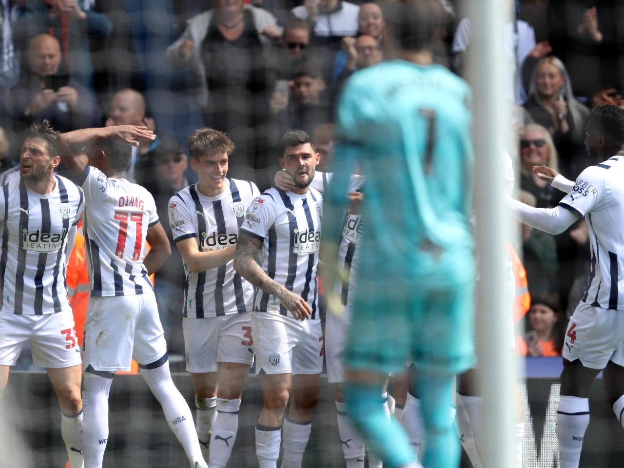 Alex Mowatt celebrates scoring a penalty against Preston with team-mates