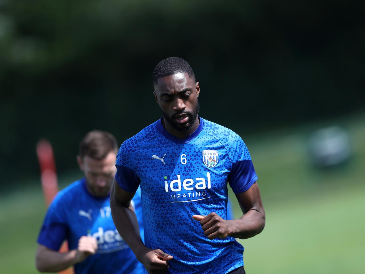 Semi Ajayi warming up before training