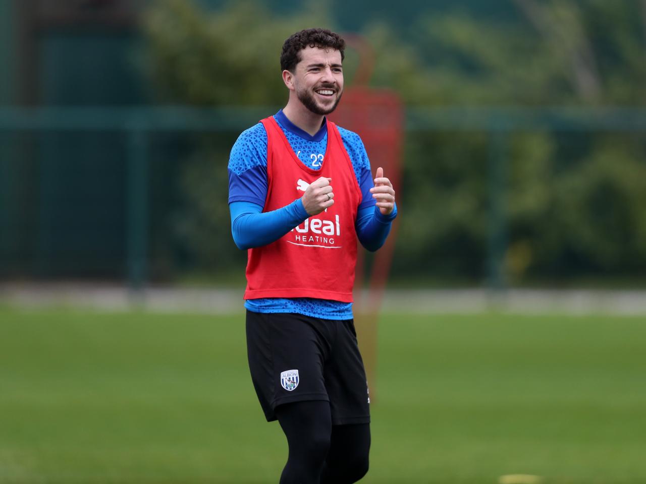 Mikey Johnston smiling during a training session