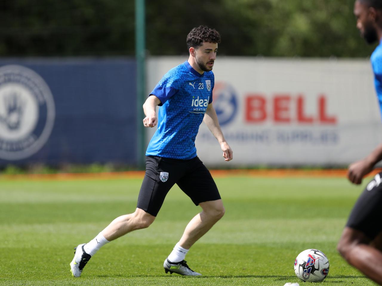Mikey Johnston on the ball during training 