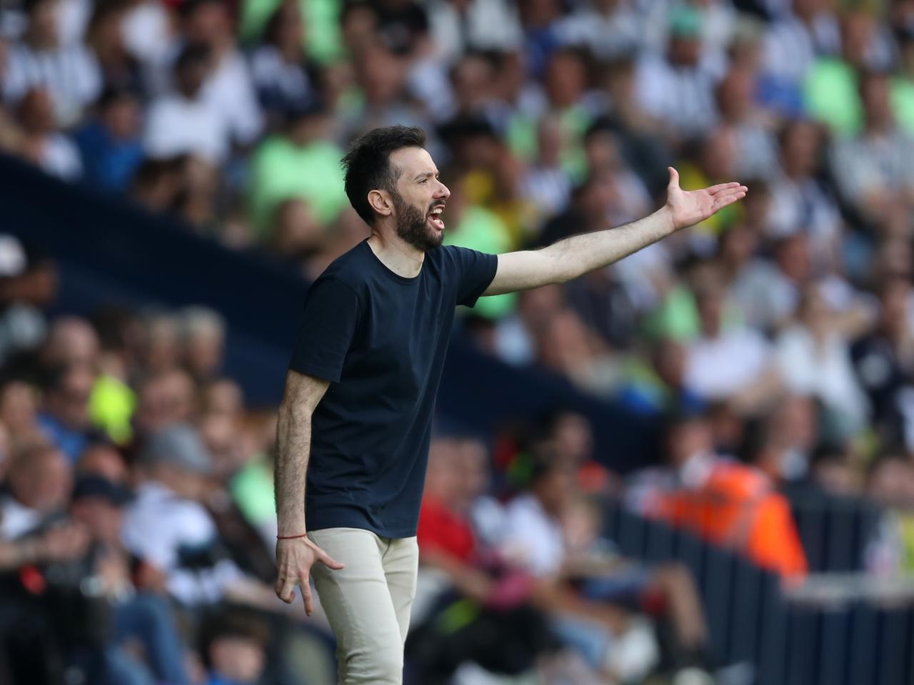 Carlos Corberán delivering a message to his players on the sideline against Southampton at The Hawthorns
