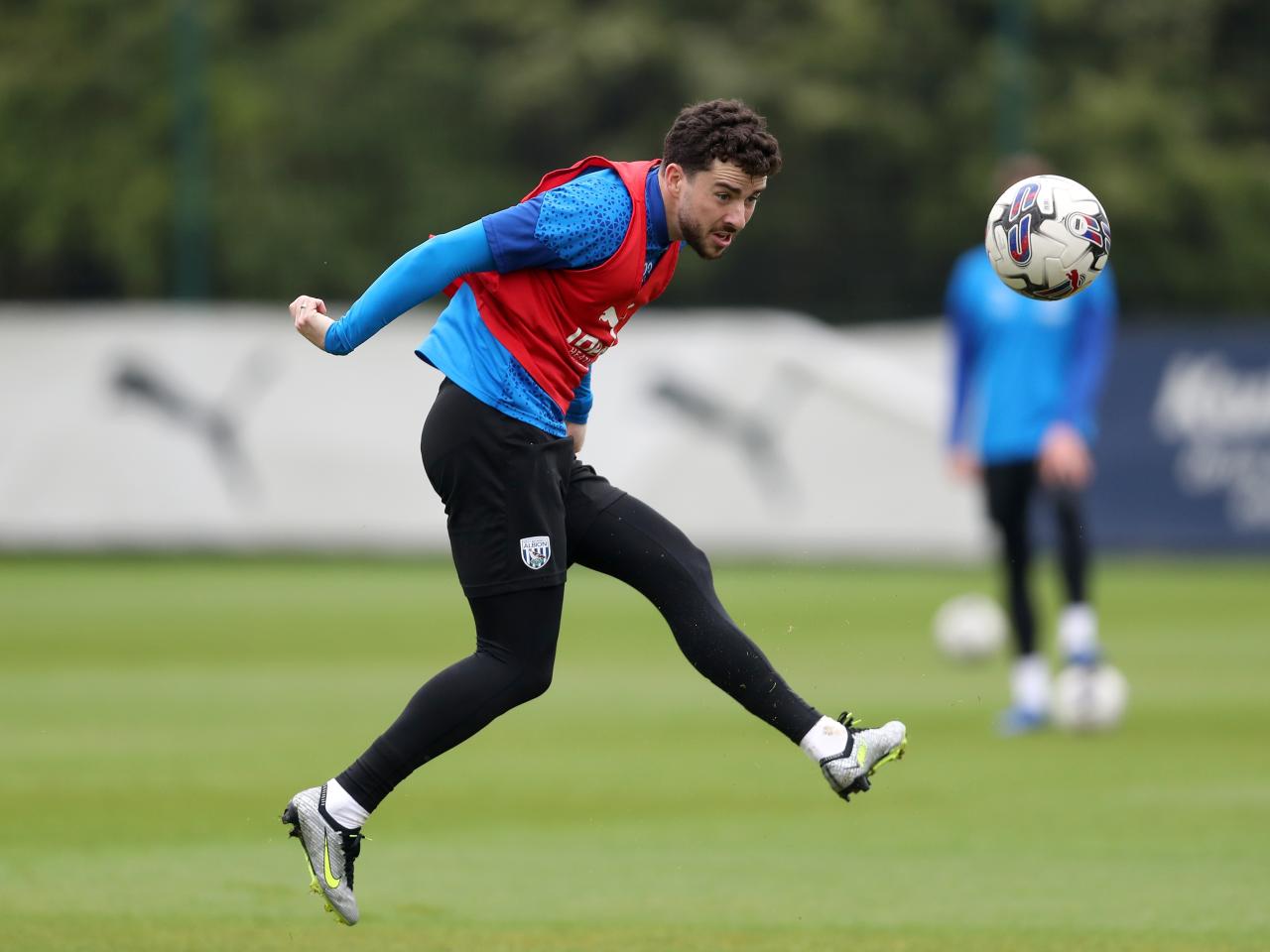 Mikey Johnston heading the ball during a training session