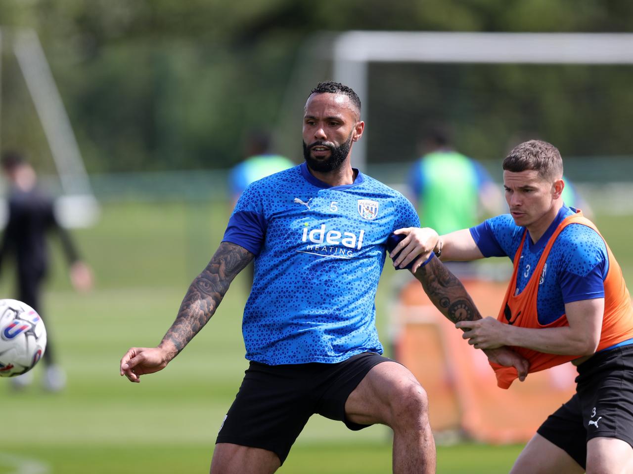 Kyle Bartley fighting Conor Townsend for the ball in training 