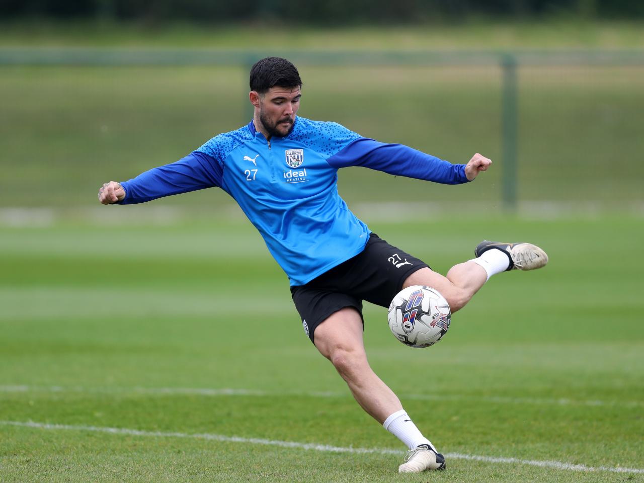 Alex Mowatt striking the ball during the training session