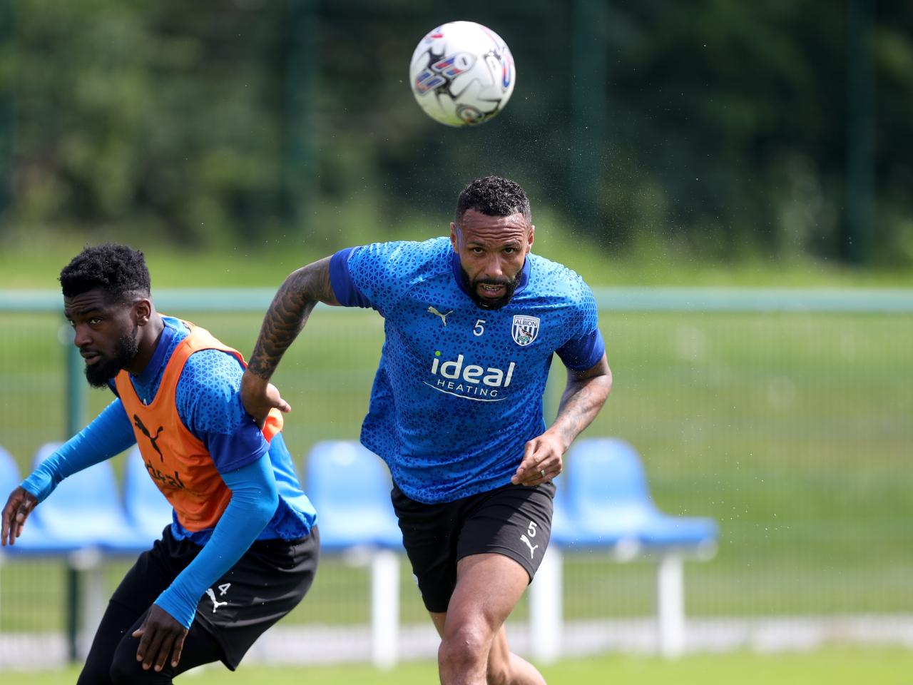 Kyle Bartley heading the ball during training