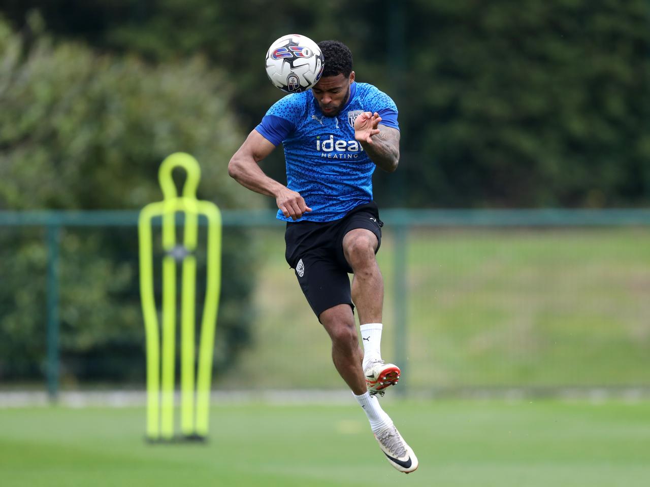 Darnell Furlong heading the ball during a training session