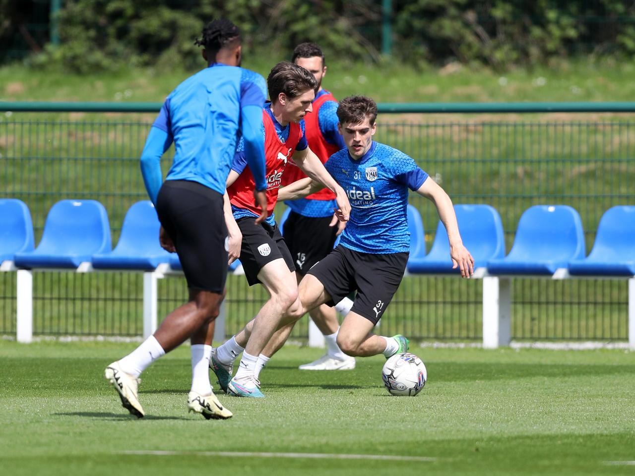 Adam Reach on the ball with Tom Fellows close by during training 