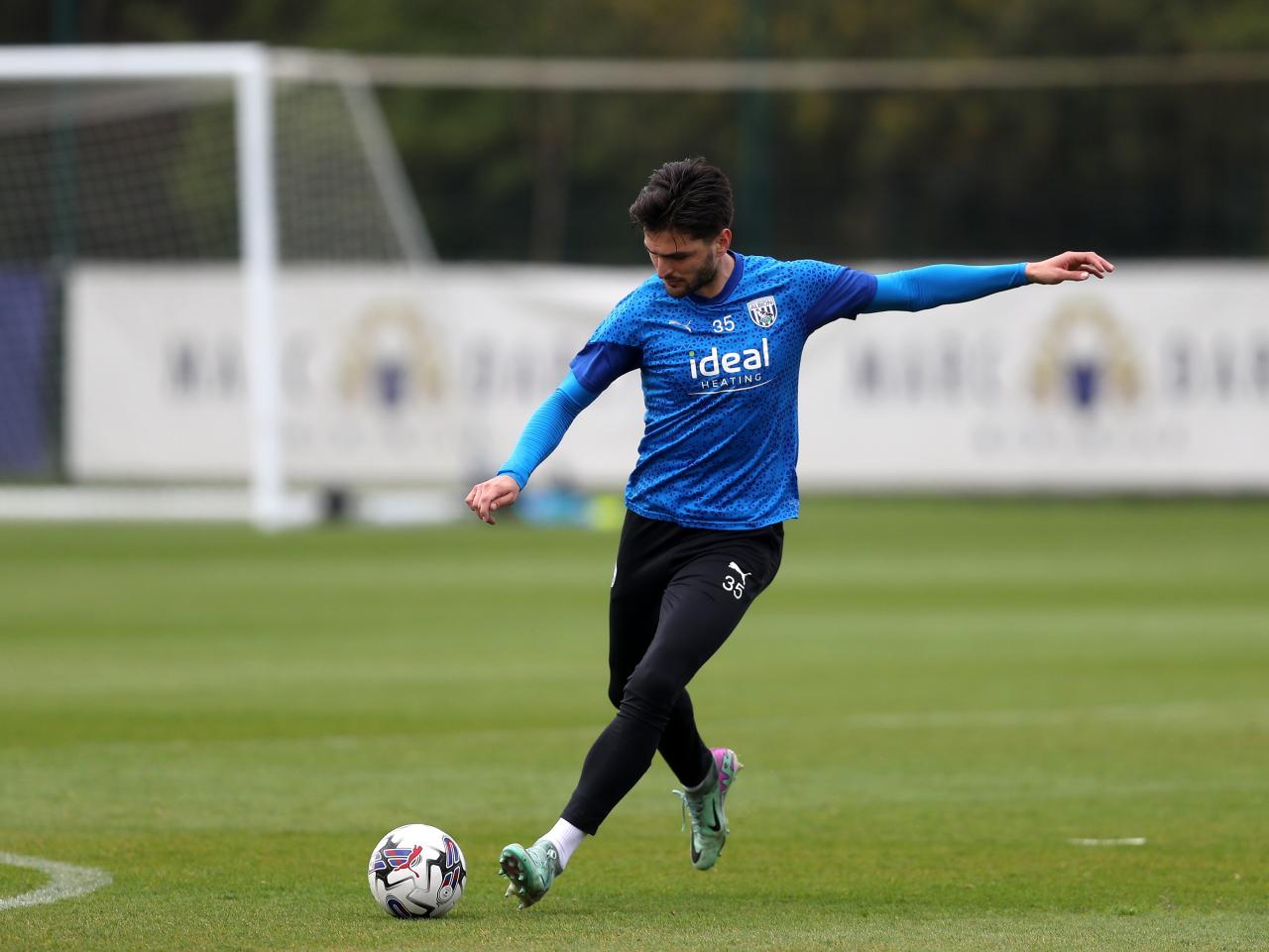 Okay Yokuslu striking the ball during a training session 