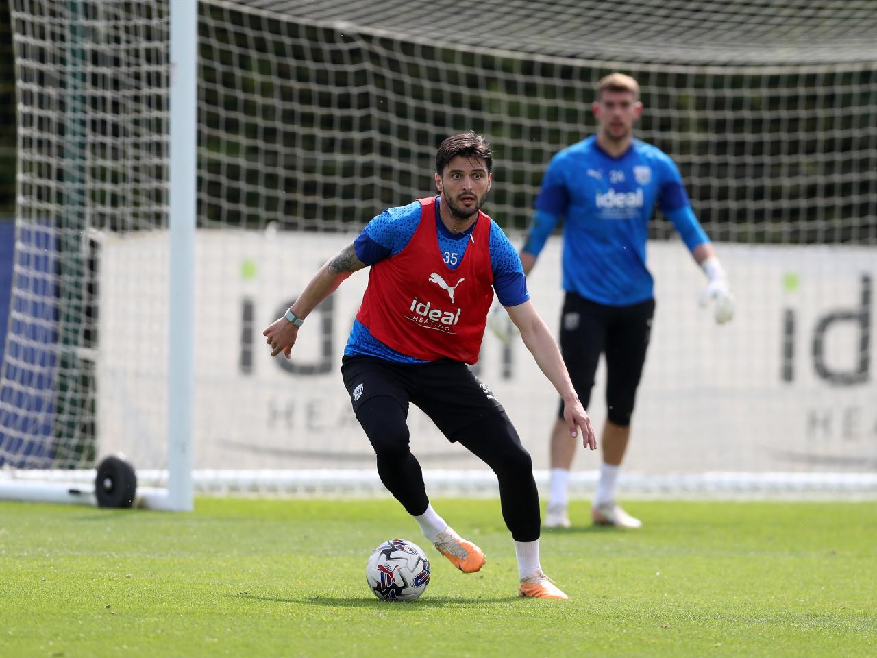 Okay Yokuslu on the ball during training 
