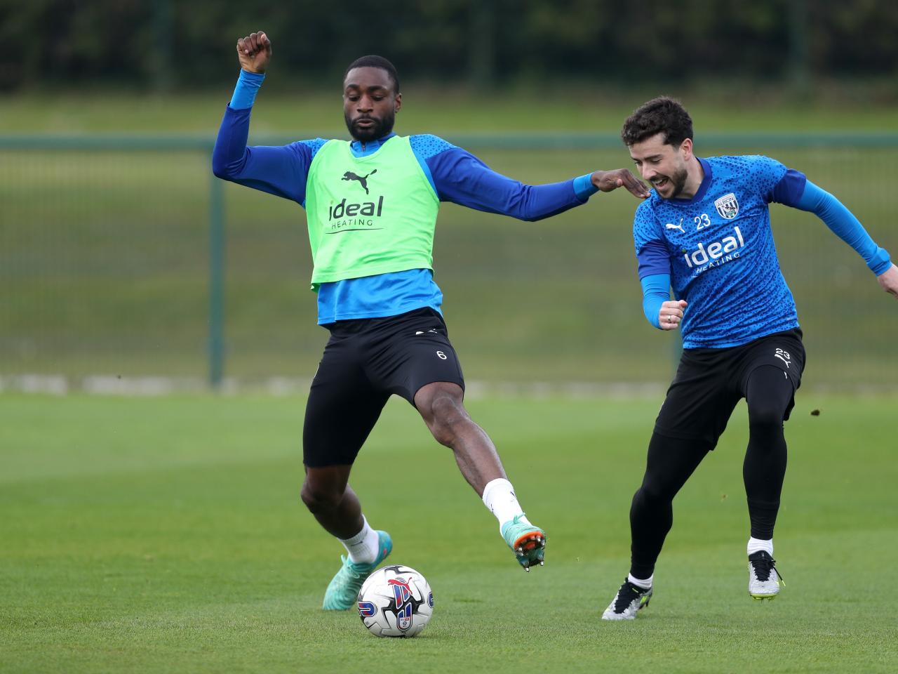 Semi Ajayi and Mikey Johnston fighting for the ball during a training session