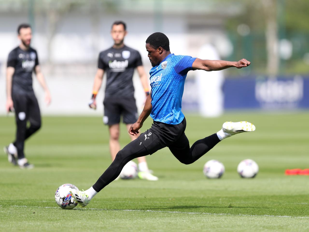 Josh Maja striking the ball during training 
