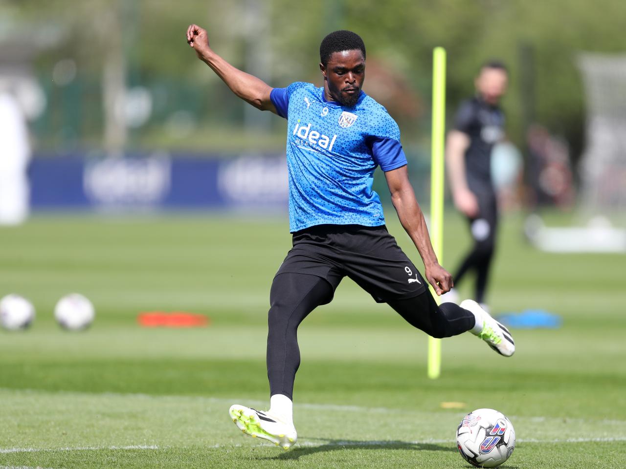 Josh Maja striking the ball during training 