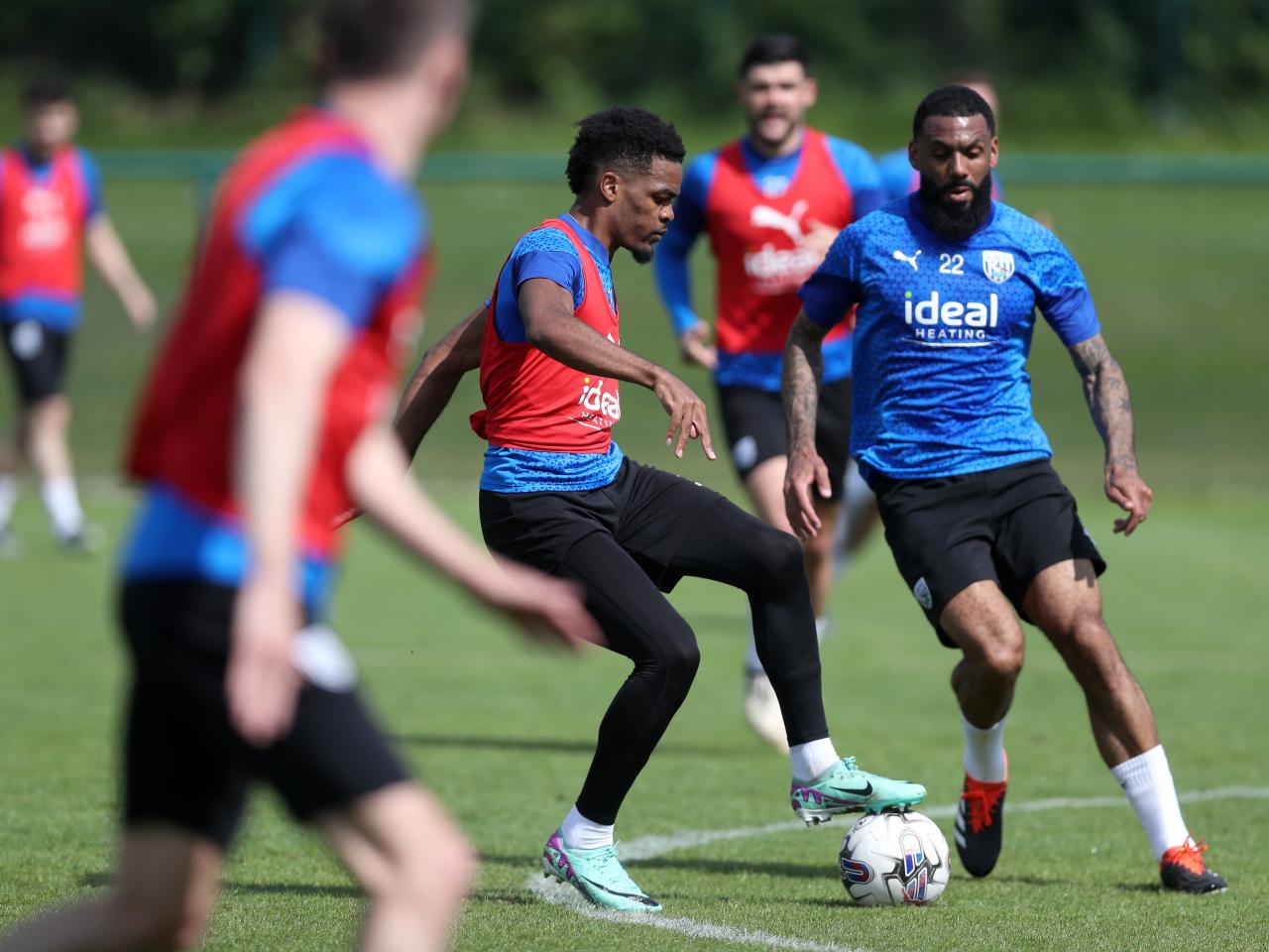Grady Diangana on the ball during training with Yann M'Vila close by
