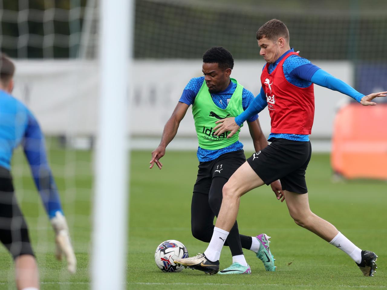 Grady Diangana and Conor Townsend fight for the ball during a training session