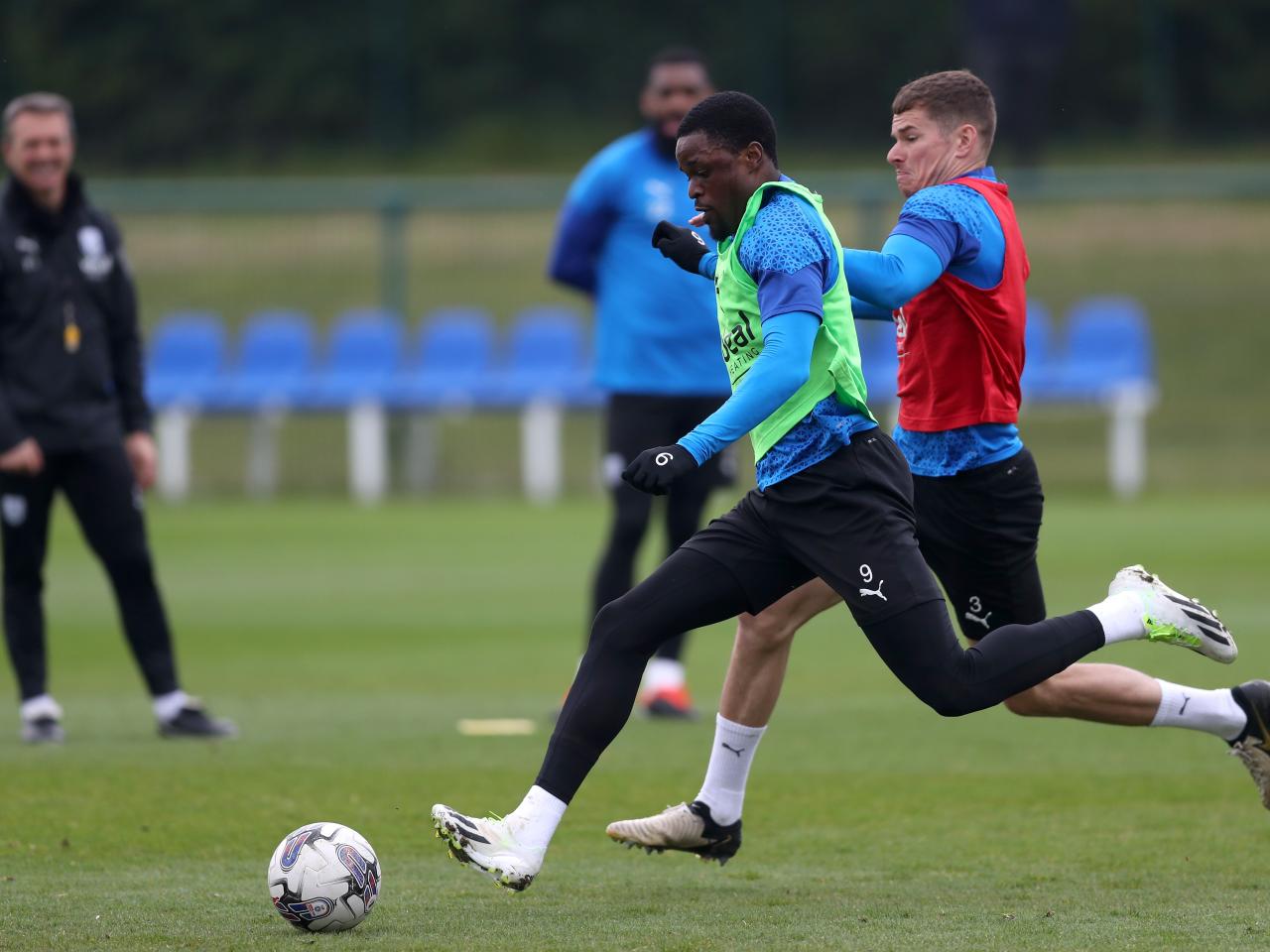 Josh Maja and Conor Townsend fighting for the ball during a training session