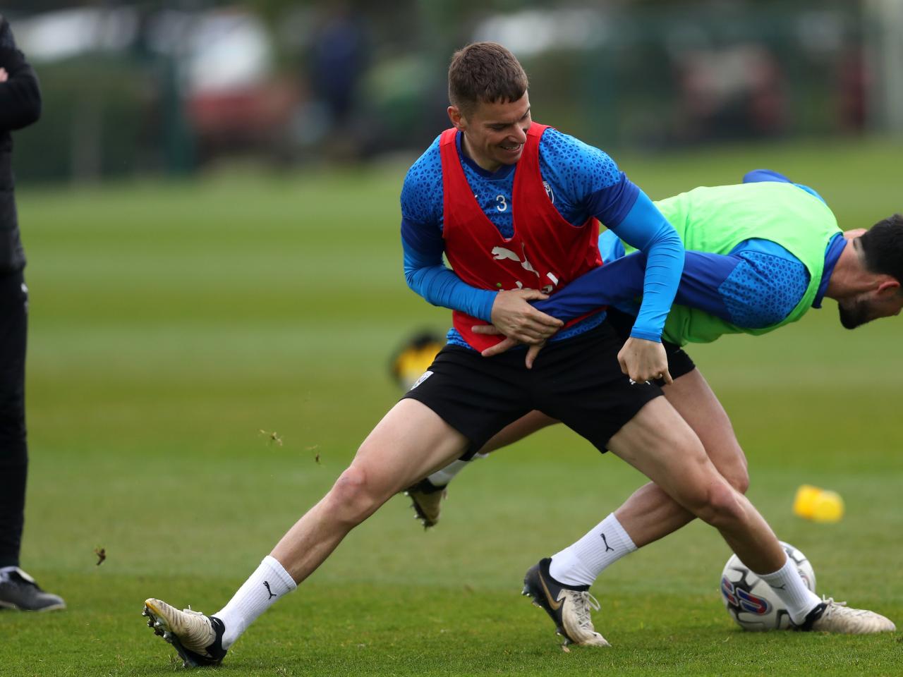 Conor Townsend and Alex Mowatt fighting for the ball during a training session 