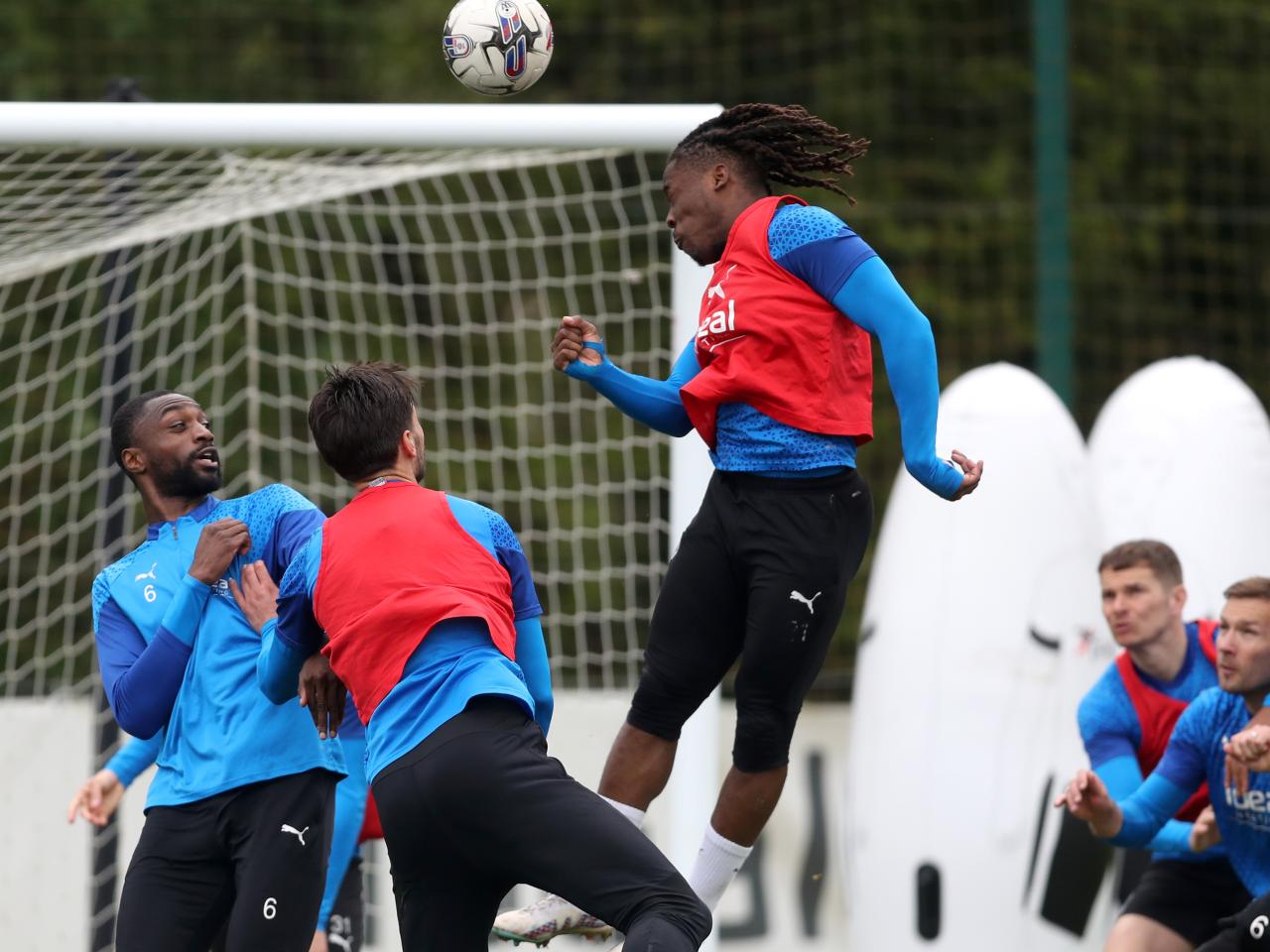 Brandon Thomas-Asante heads towards goal during a training session 