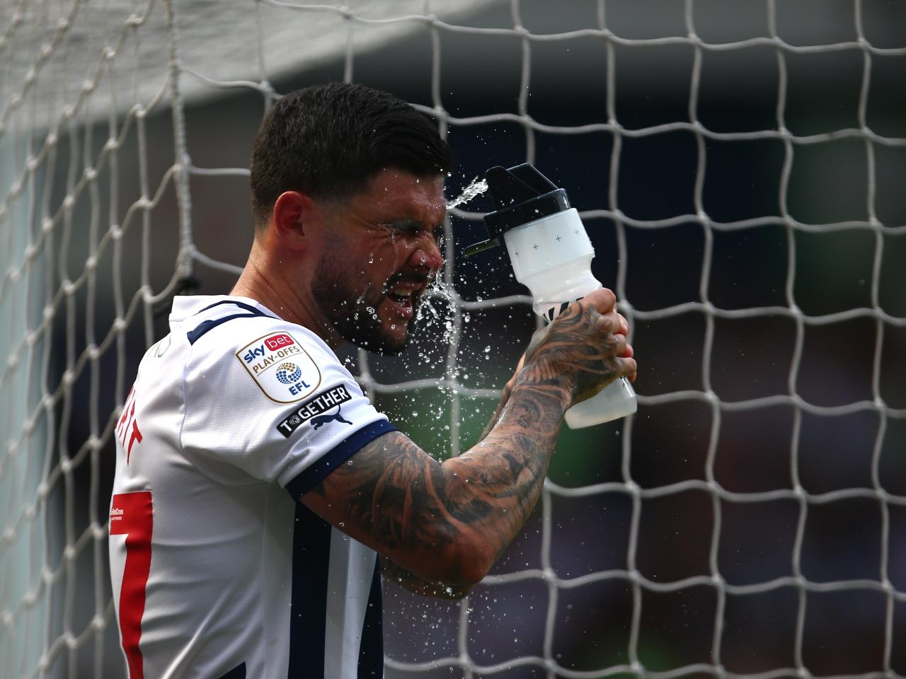 Alex Mowatt squirts water in his face at The Hawthorns against Southampton 